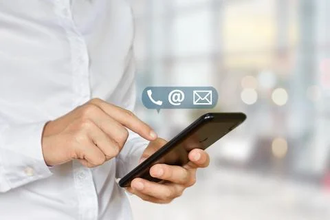 Close-up of male hand using smartphone with ( mail, phone, email ) icon. Idea Stock Photos