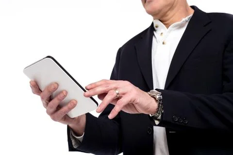 Close up of male hand using tablet Stock Photos