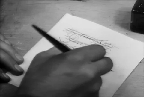 Close-up of male hand writing a note with fountain pen, 1930s Stock Footage 95348178