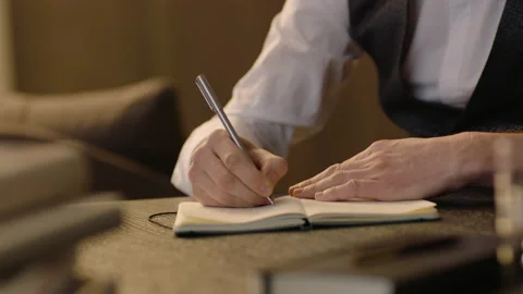 Close-up of male hands and notebook of unidentified young writer. Stock Footage 236772729