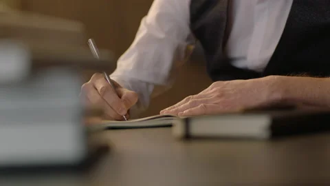 Close-up of male hands and notebook of unidentified young writer. Stock Footage 236772929