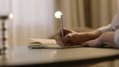 Close-up of male hands and notebook Stock Footage 236775085