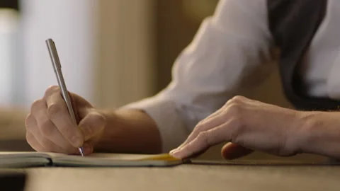 Close-up of male hands and notebook Stock Footage 236775101