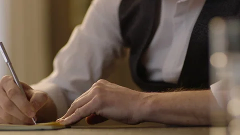 Close-up of male hands and notebook Stock Footage 236775112