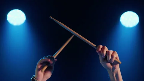 Close-up of male hands beating out the rhythm with drumsticks Stock Footage 194440177