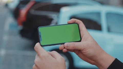 Close-up of male hands browsing application on horizontal mock-up smartphone Stock Footage 117427459