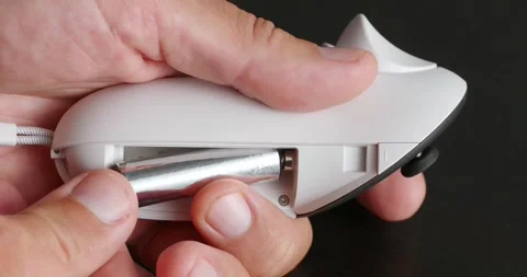 Close-up of male hands changes battery in wireless joystick for VR headset. Video stock 258064167