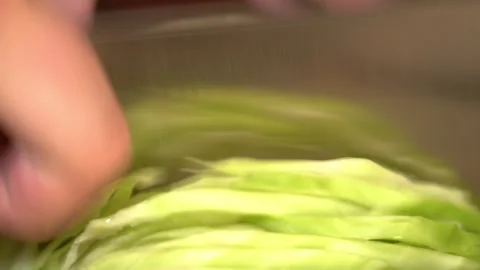 Close up male hands chopped cabbage on wooden board. Stock Footage 254591089