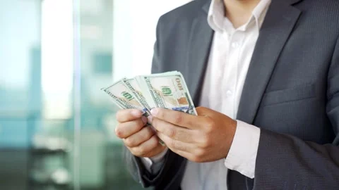 Close up. Male hands count one hundred dollar US bills. Young businessman  Stock Footage 251880143