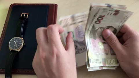 Close up of male hands counting large amounts of money by hand in cash. Business Stock-Footage 137312642