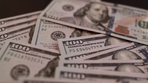 Close-up of male hands counting a stack of hundred-dollar US banknotes Stock Footage 237701418