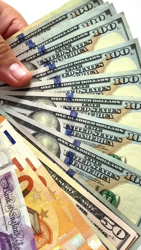 Close-up of male hands counting a stack of hundred-dollar US banknotes Stock Footage 264979726