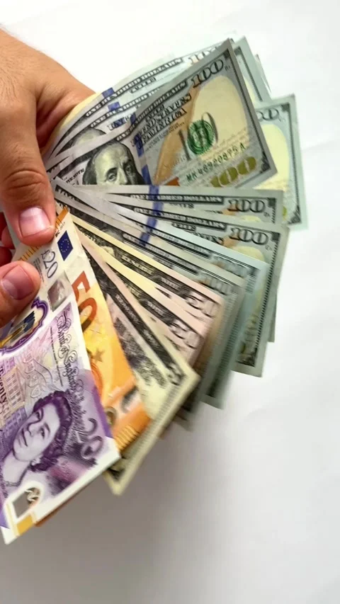 Close-up of male hands counting a stack of hundred-dollar US banknotes. Stock Footage 264979910
