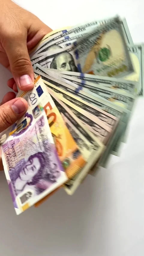 Close-up of male hands counting a stack of hundred-dollar US banknotes Stock Footage 264980003