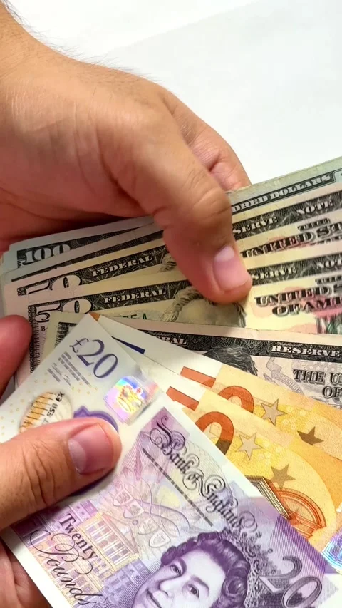 Close-up of male hands counting a stack of hundred-dollar US banknotes Stock Footage 264980155