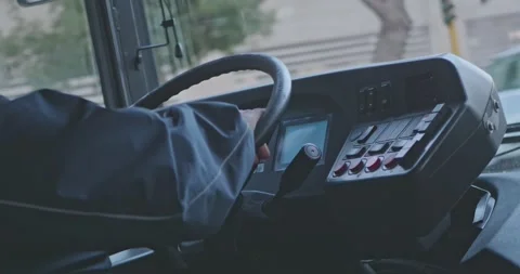 Close up of male hands. The driver is sitting at steering wheel of a bus Video stock 239725786