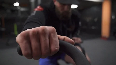 Close up of Male Hands Exercising on the Machine at the Gym. Stock Footage 129033439