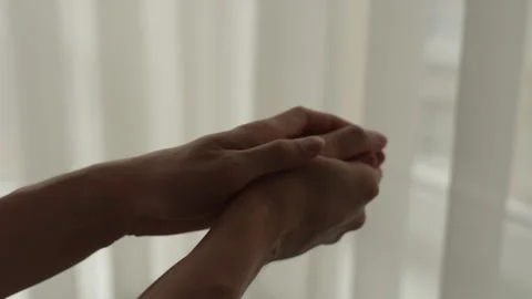 Close-up of male hands gently applying moisturizer cream on arm, focusing on Stock Footage 297631010