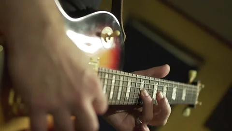 Close-up. male hands hit the strings, solo guitar lesson Stock Footage 207134539
