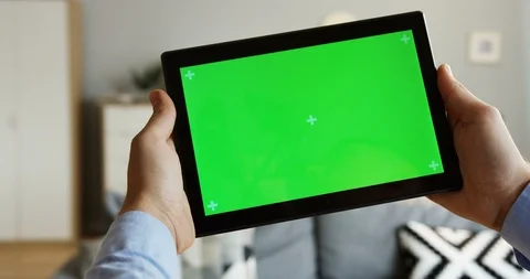 Close up of the male hands holding a black tablet computer horizontally with a Stock Footage