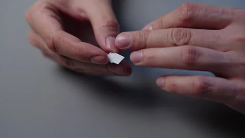 Close-up of male hands holding micro SD card and SD card adapter, inserting Stock Footage 318522528