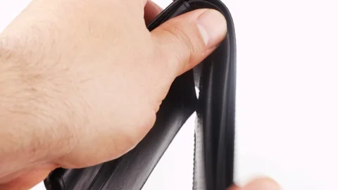 Close up male hands open empty leather wallet with no money. Poverty or crisi Stock Footage 129850300