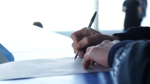 Close-up of male hands with pen over document. Man signs the contract close-up Stock Footage 86250853