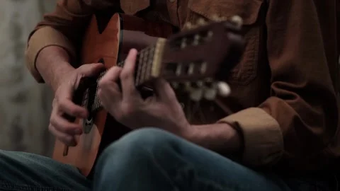 Close-up male hands playing classical acoustic guitar. Stock Footage 320207441