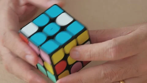 Close-up of male hands playing Puzzle cube. Stock Footage 155347089