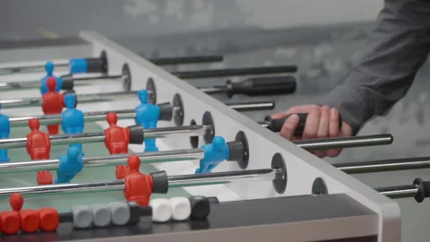 Close-up of male hands playing table football 스톡 동영상 166609833