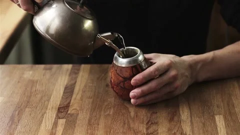 Close up of male hands preparing mate ethnic energetic drink  Stock Footage