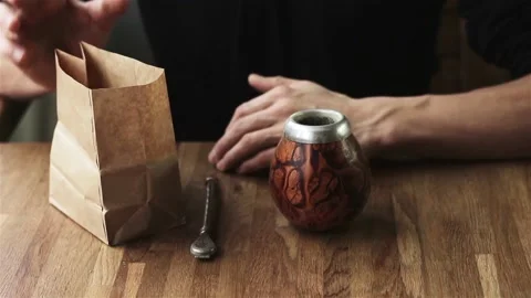 Close up of male hands preparing mate ethnic energetic drink  動画素材 85706973