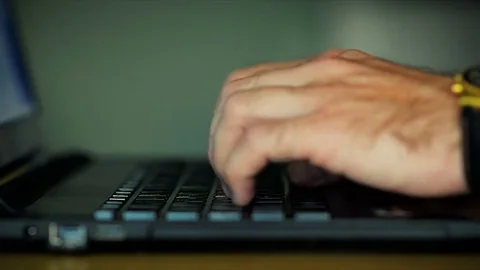 Close-Up of Male Hands Prints on the Laptop Keyboard Stock Footage