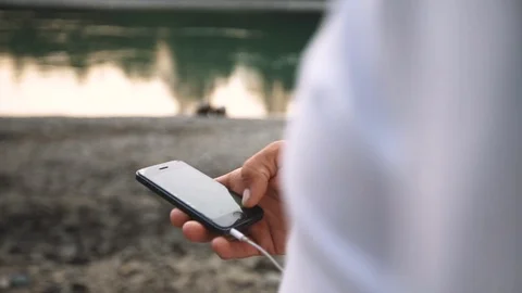 Close-up male hands scrolling screen on smartphone. Person using calendar app on Stock-Footage 89620734