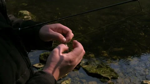Close up from male hands setting up fishhook Stock Footage 171529930