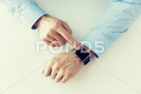 Close up of male hands setting smart watch Stock Photos