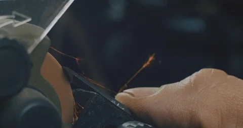 Close-Up Of Male Hands, Sharpening A Chisel On A Electric Grindstone. 4K Video Stock Footage 121975735