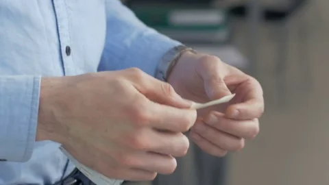 Close-up of male hands sticking a note on window in the office. Stock Footage 82232061