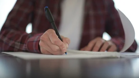 Close up of male hands taking notes in notebook. Stock-Footage 91508216