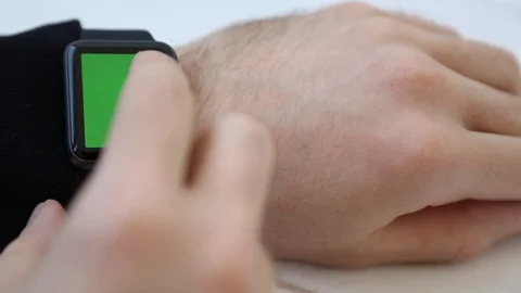 Close up of Male Hands Touching and Tapping Smart Watch with Green Screen. Stock Footage 116613786