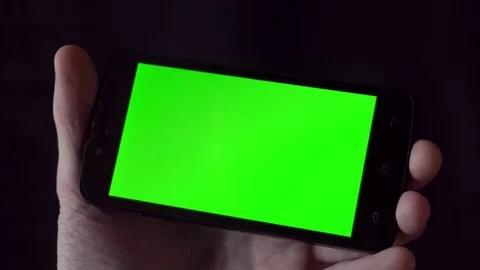 Close-up of male hands touching of smartphone. Green screen Chroma Key. Close up Stock Footage 75532143