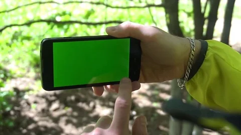 Close-up of male hands touching of smartphone. Green screen Chroma Key. Close up Stock Footage 75915251
