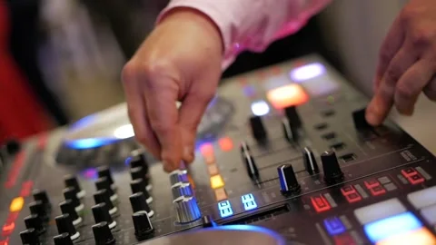 Close up of male hands turning knobs on professional DJ mixer console 스톡 동영상 101779006