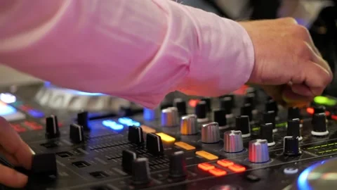 Close up of male hands turning knobs on professional DJ mixer console 스톡 동영상 101779046