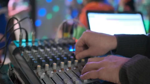 Close up of male hands turning knobs on professional DJ mixer console Video stock 111285122