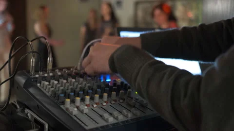 Close up of male hands turning knobs on professional DJ mixer console Stock Footage 111285161