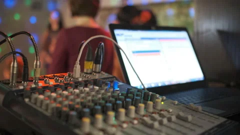 Close up of male hands turning knobs on professional DJ mixer console Stock Footage 111285363