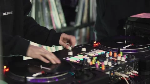 Close up of male hands turning knobs on professional DJ mixer console. Art 動画素材 234906985