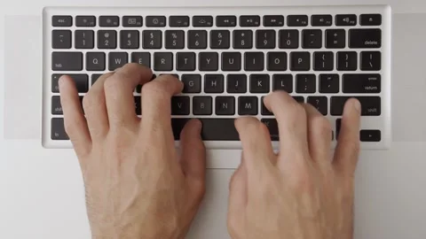 Close up. Male hands type rapidly and quickly on a modern computer keyboard Stock Footage 136938174