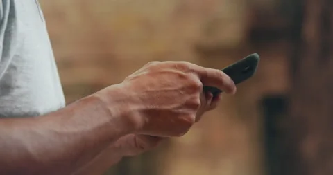 Close-up Male Hands Typing Message on Mobile Phone Outdoors at Barcelona City Stock-Footage 148347718